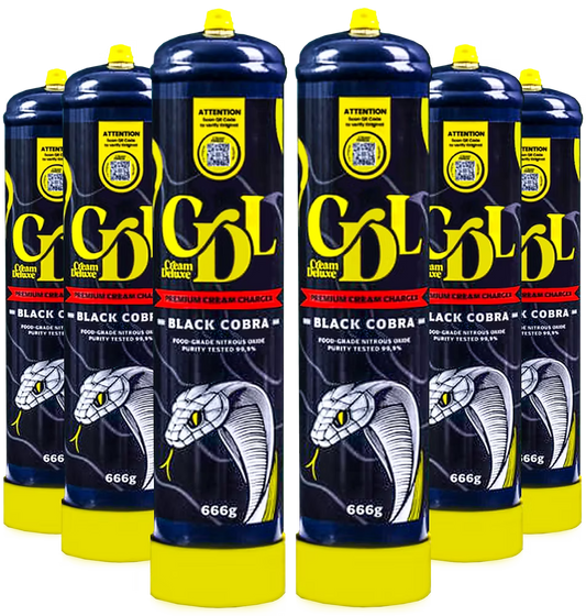 Multiple bottles of Black Cobra premium cream charchoal with yellow caps on a white background